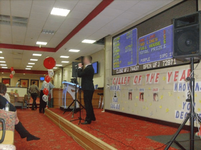 A bingo caller doing his job