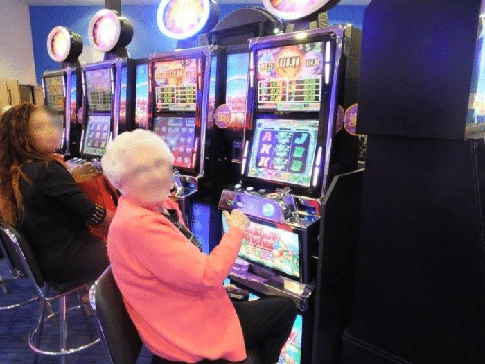 A loyal patron plays a slot game